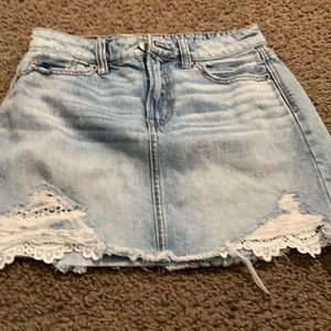 4 pocket denim skirt with white  lace at bottom